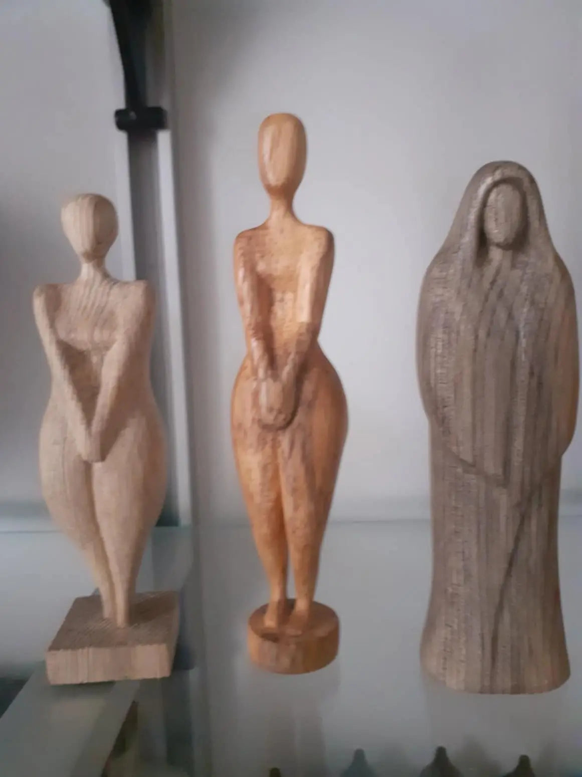 Collection of Hand-Carved Wooden Sculptures of Women